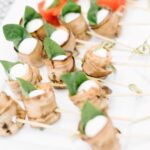 Roasted Red Pepper, Goat Cheese & Basil Skewers (back); Eggplant, Goat Cheese & Basil Skewers (front)